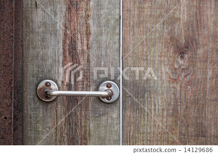 Door handle on wood background 14129686