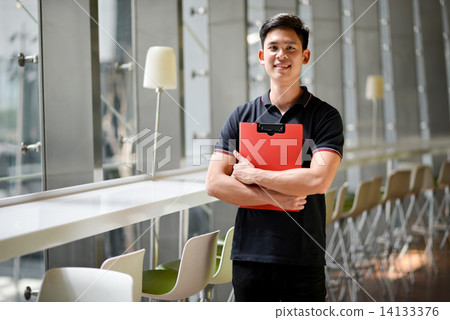 Young male adult student in campus 14133376