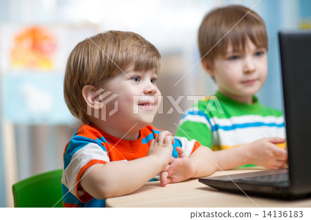happy kids looking at laptop 14136183