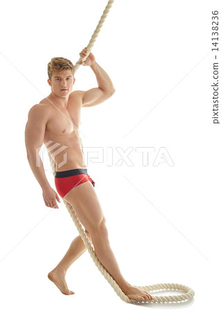 Handsome male model posing in underwear with rope 14138236