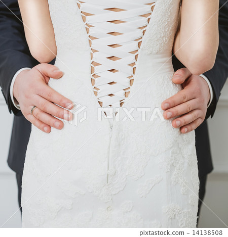 Elegant bride and groom posing together Elegant bride and groom posing together 14138508