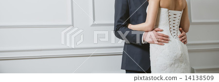 Elegant bride and groom posing together Elegant bride and groom posing together 14138509