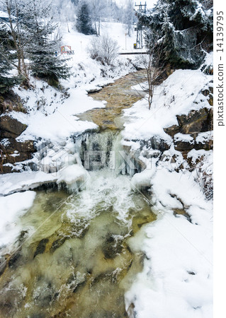 small waterfall on mountain river at winter small waterfall on mountain river at winter 14139795