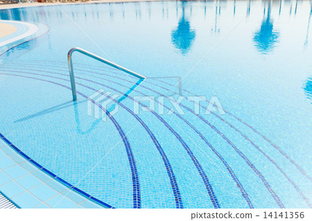 pool with reflections of palm trees 14141356