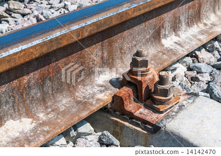 Railroad nut and bolt on background of gravel Railroad nut and bolt on background of gravel 14142470