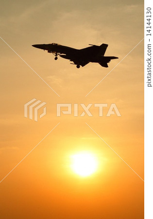 U.S. Navy FA-18E Super Hornet Flying Battle Attacking Machine flying with a beautiful sunset U.S. Navy FA-18E Super Hornet Flying Battle Attacking Machine flying with a beautiful sunset 14144130