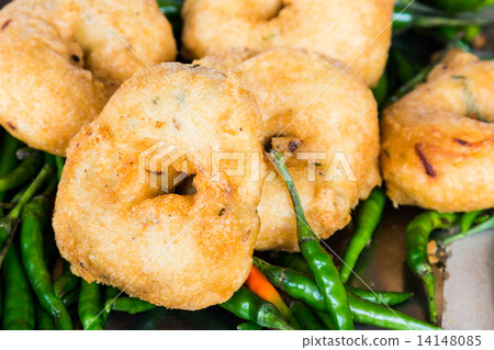 Uluntu Vadai with green chili pepper, a popular Southern Indian deep fried snack 14148085