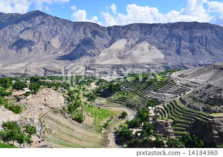 Village along the Karakoram Highway in northern Pakistan Chiraas Beautiful mountains and rice terraces Village along the Karakoram Highway in northern Pakistan Chiraas Beautiful mountains and rice terraces 14184360