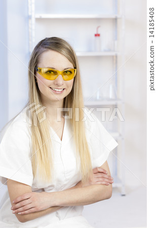 portrait of young woman with protective glasses in laboratory portrait of young woman with protective glasses in laboratory 14185408