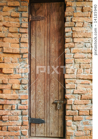 Tall door on the brick wall Tall door on the brick wall 14185940