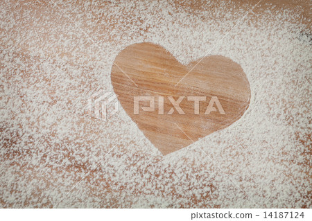 The heart of the flour on the table from the old boards The heart of the flour on the table from the old boards 14187124