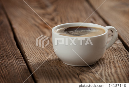 A cup of coffee on the table of the old boards 14187148
