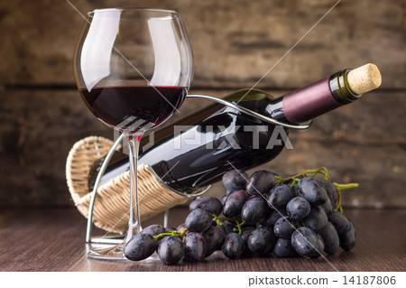 Winery background. Wineglass with bottle of red wine and cluster of grape 14187806