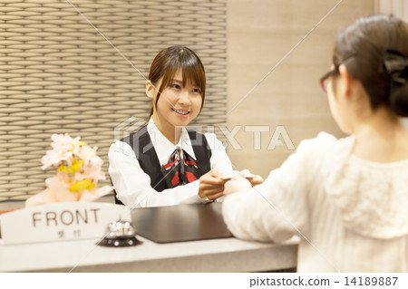 A cute girl in the front desk of the hotel 14189887