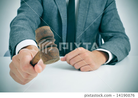 man about to struck a gavel 14190876