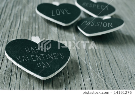 happy valentines day in a heart-shaped chalkboard, in black and happy valentines day in a heart-shaped chalkboard, in black and 14191276