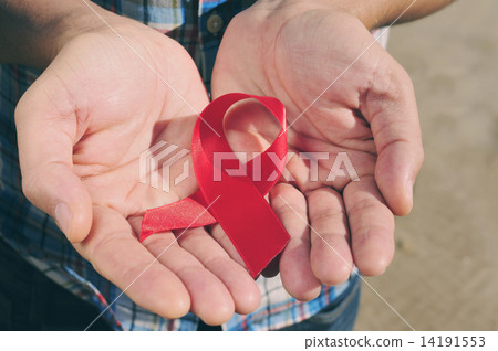 red ribbon for the fight against AIDS, with a filter effect 14191553