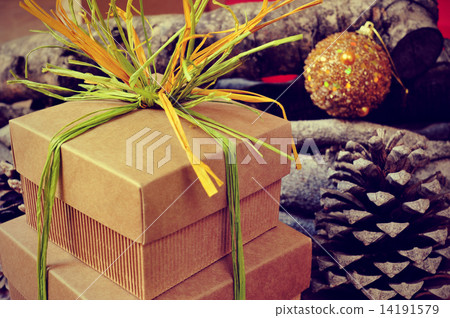 gift boxes tied with natural raffia of different colors on a rus gift boxes tied with natural raffia of different colors on a rus 14191579