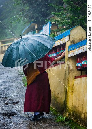 Buddhist monk with umbrella in McLeod Ganj Buddhist monk with umbrella in McLeod Ganj 14198412