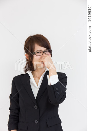 A woman holding a nose 14199394