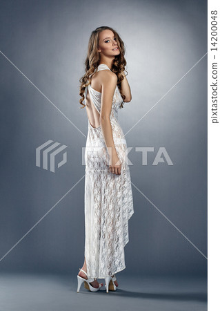 Attractive young model wearing sexy long negligee Attractive young model wearing sexy long negligee 14200048