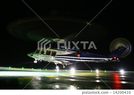 Helicopter landing on oil and gas platform in night time for training. New pilot traning landing on Helicopter landing on oil and gas platform in night time for training. New pilot traning landing on 14200410