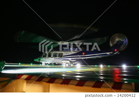 Helicopter landing on oil and gas platform in night time for training. New pilot traning landing on Helicopter landing on oil and gas platform in night time for training. New pilot traning landing on 14200412