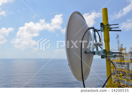 Satellite dish antennas under sky, Communication equipment in offshore oil and gas industry. Satellite dish antennas under sky, Communication equipment in offshore oil and gas industry. 14200535