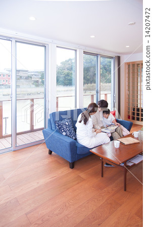 Four people relaxing in the living room 14207472