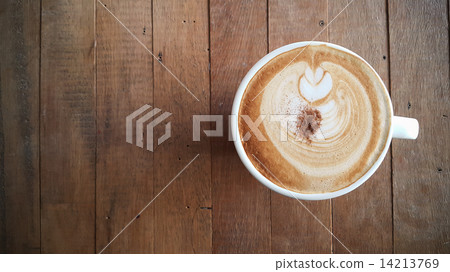Coffee cup or fresh coffee on wooden table in morning time. Coffee cup or fresh coffee on wooden table in morning time. 14213769