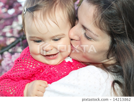 Mother with baby in the garden Mother with baby in the garden 14213862
