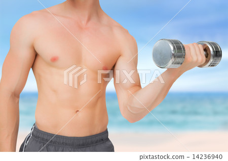 Composite image of fit shirtless man lifting dumbbell 14236940