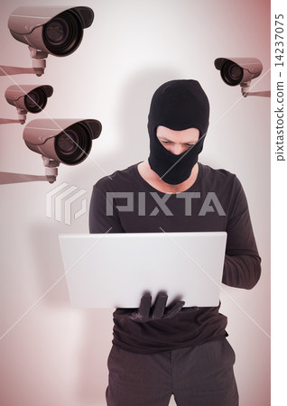 Composite image of hacker using laptop to steal identity Composite image of hacker using laptop to steal identity 14237075