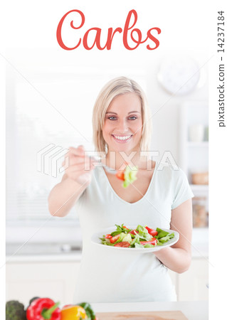 Carbs against blonde woman offering salad 14237184