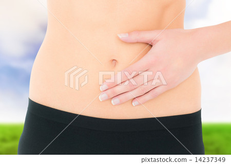 Composite image of closeup mid section of a fit woman with stoma Composite image of closeup mid section of a fit woman with stoma 14237349