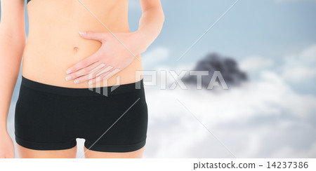 Composite image of closeup mid section of a fit woman with stoma Composite image of closeup mid section of a fit woman with stoma 14237386