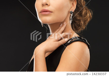 woman with diamond earrings 14238337