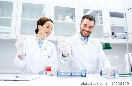 Stock Photo: young scientists making test or research in lab