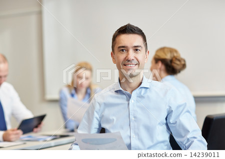 smiling group of businesspeople meeting in office 14239011