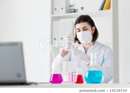 close up of scientist making test in lab close up of scientist making test in lab 14239134