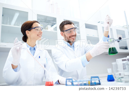 Stock Photo: young scientists making test or research in lab