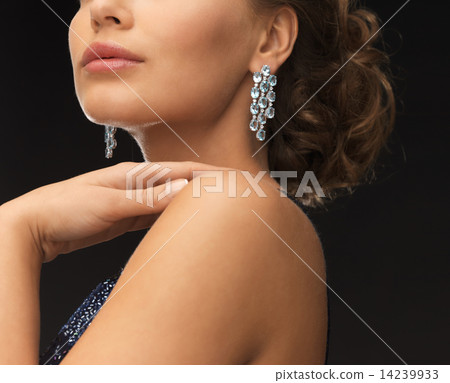woman with diamond earrings woman with diamond earrings 14239933