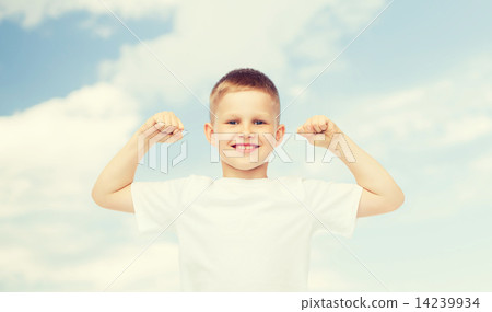 happy little boy in white t-shirt flexing biceps happy little boy in white t-shirt flexing biceps 14239934