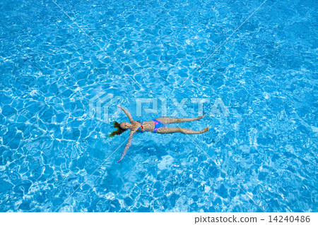 The woman swims in the sea 14240486