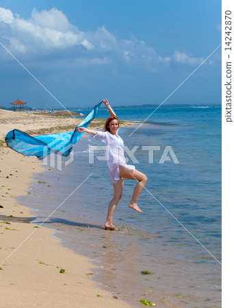 The young attractive woman jumping in the sea The young attractive woman jumping in the sea 14242870