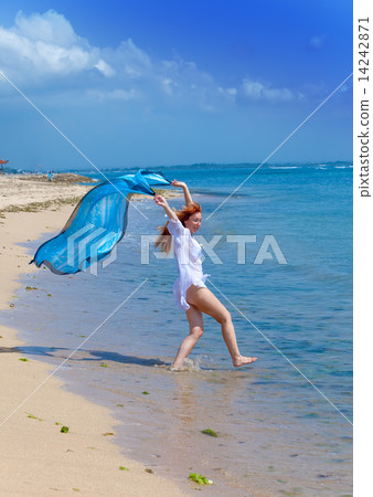 The young beautiful woman on an ocean coast. Indonesia. Bali. The young beautiful woman on an ocean coast. Indonesia. Bali. 14242871