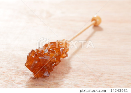 Candy brown  sugar on a sticks. 14243981