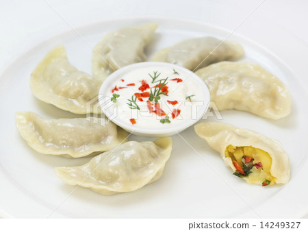 Nepalese food momo on a white background in the restaurant Nepalese food momo on a white background in the restaurant 14249327
