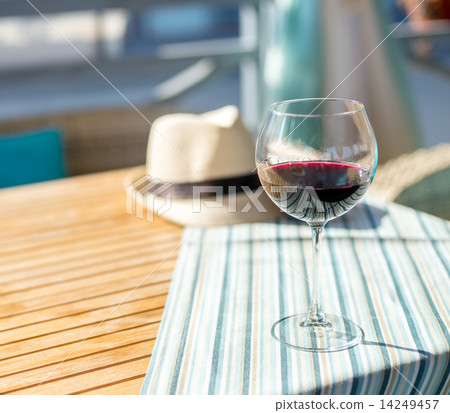 Glass of wine on the table Glass of wine on the table 14249457
