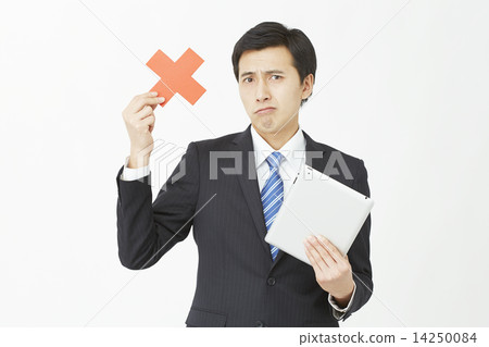 A businessman holding a tablet and putting out a cross 14250084